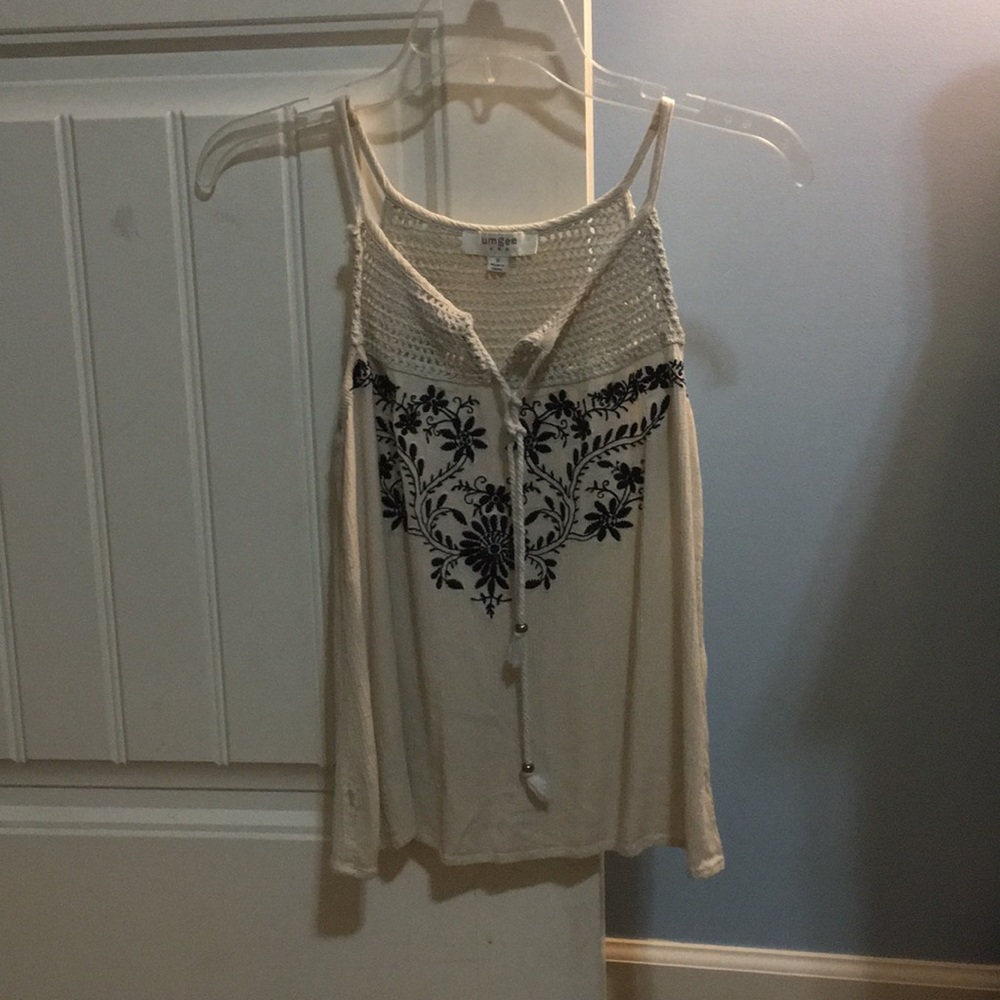 Sleeveless, tan tank top.